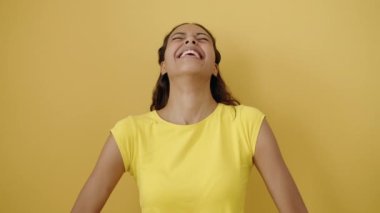 Young african american woman smiling confident standing over isolated yellow background