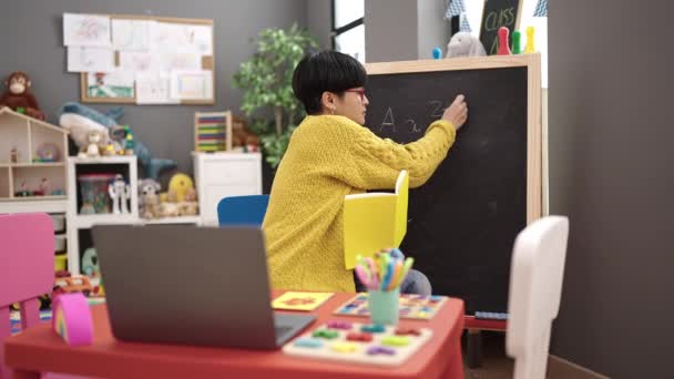 Young Chinese Woman Preschool Teacher Having Online Class Kindergarten — Vídeos de Stock