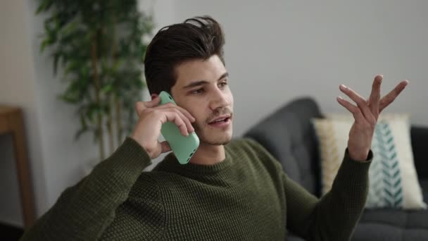 Young Hispanic Man Talking Smartphone Unhappy Expression Home — Video