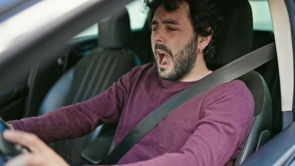 Young Hispanic Man Driving Car Yawning Street — Stock Video