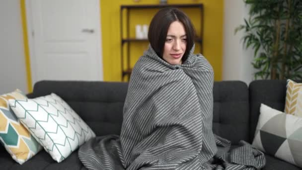 Young Beautiful Hispanic Woman Covering Blanket Cold Home — Stockvideo