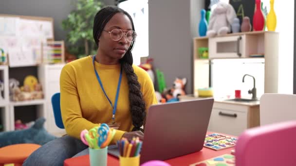 African Woman Preschool Teacher Using Laptop Kindergarten — Stockvideo