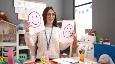 Young beautiful hispanic woman preschool teacher having emotional therapy at kindergarten