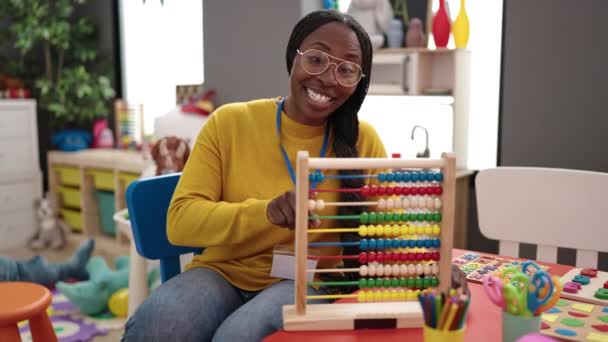African Woman Working Teacher Teaching Maths Abacus Kindergarten — Stockvideo
