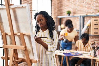 African american friends artists smiling confident drawing at art studio