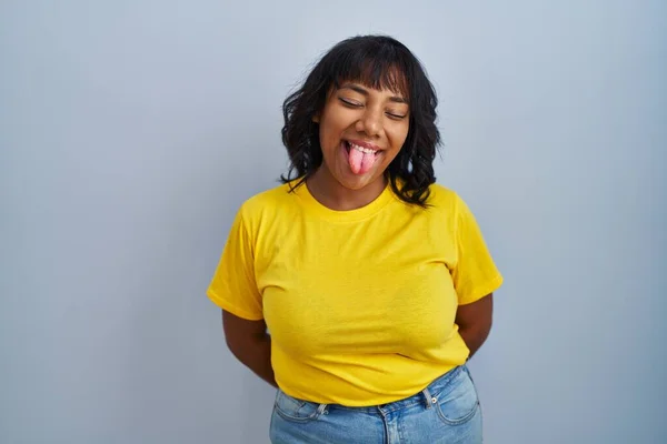 Hispanic Woman Standing Blue Background Sticking Tongue Out Happy Funny — Photo
