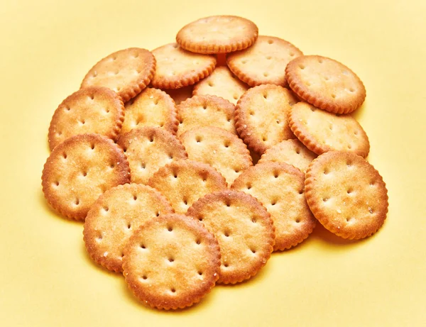 Delicious Group Salty Biscuits Isolated Yellow Background — Fotografia de Stock