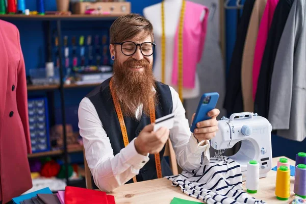 Young Redhead Man Tailor Using Smartphone Credit Card Clothing Factory — Foto Stock