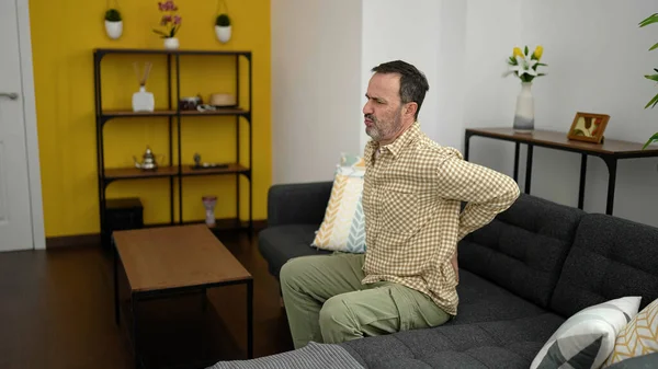 Middle Age Man Suffering Backache Sitting Sofa Home — Stok fotoğraf