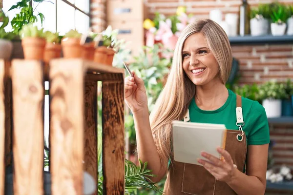 Young Blonde Woman Florist Smiling Confident Writing Notebook Flower Shop — Stock Photo, Image