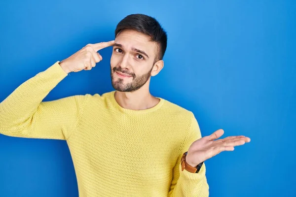 Hispanic Man Standing Blue Background Confused Annoyed Open Palm Showing — Fotografia de Stock
