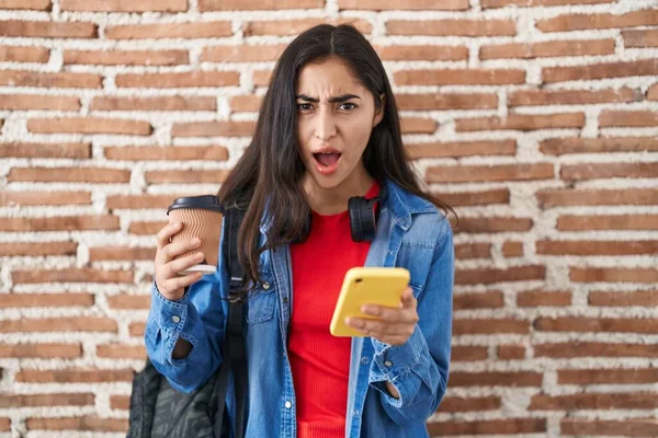 Young Teenager Girl Wearing Student Backpack Using Smartphone Angry Mad — Stock Photo, Image
