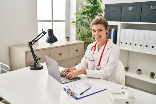 stock image Young blonde woman wearing doctor uniform working at clinic