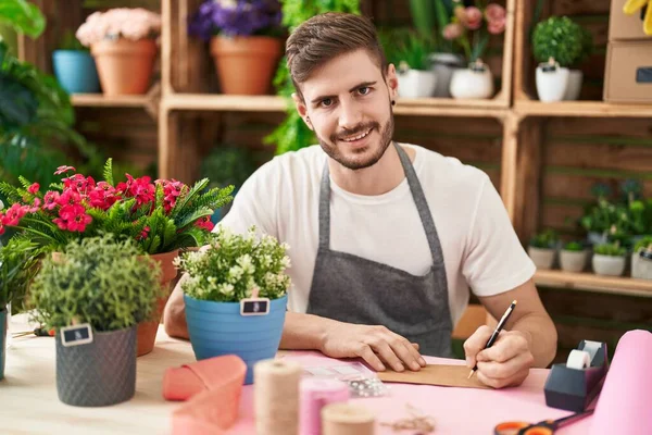 Young Caucasian Man Florist Smiling Confident Writing Envelope Letter Flower — 스톡 사진