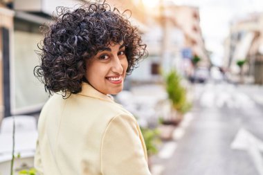 Young middle east woman excutive smiling confident standing at street