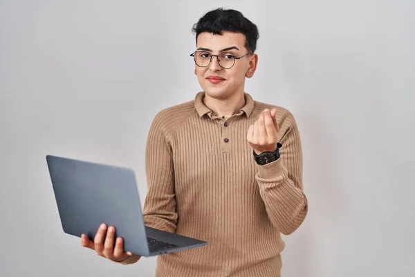 Non binary person using computer laptop doing money gesture with hands, asking for salary payment, millionaire business