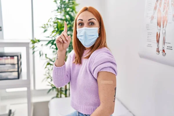 Young Woman Getting Vaccine Showing Arm Band Aid Surprised Idea — Stock Photo, Image