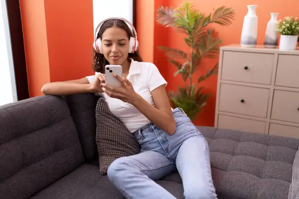 Young African American Woman Listening Music Sitting Sofa Home — 图库照片