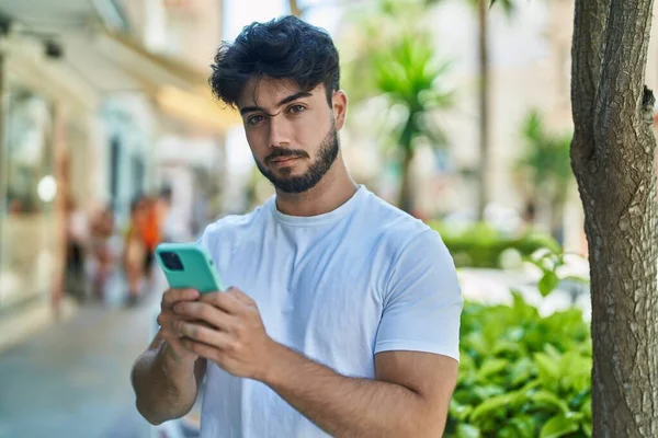 Young Hispanic Man Using Smartphone Street — Stockfoto