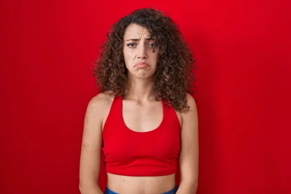 Hispanic Woman Curly Hair Standing Red Background Depressed Worry Distress — Foto de Stock