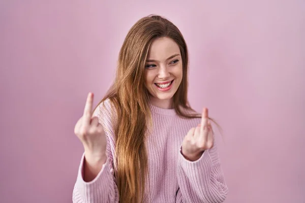 Young Caucasian Woman Standing Pink Background Showing Middle Finger Doing — Zdjęcie stockowe