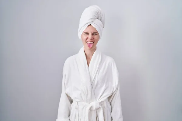 Blonde Caucasian Woman Wearing Bathrobe Sticking Tongue Out Happy Funny — Stock Photo, Image