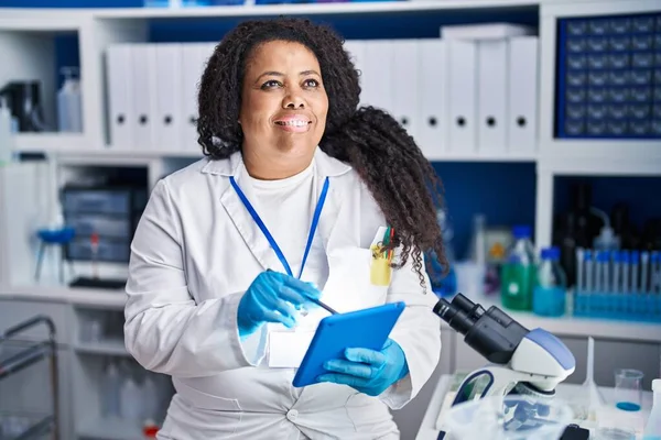 African American Woman Scientist Smiling Confident Writing Touchpad Laboratory — Stock Photo, Image