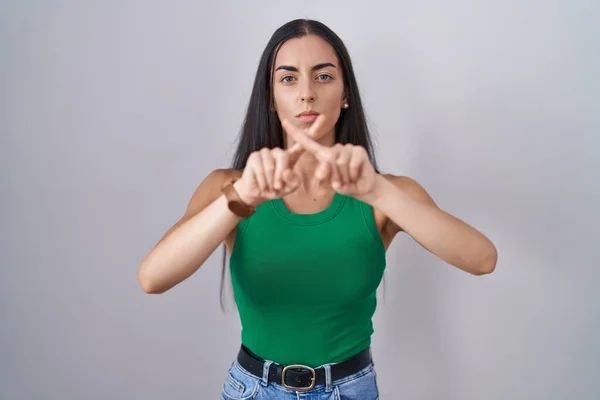 Young Woman Standing Isolated Background Rejection Expression Crossing Fingers Doing — Stockfoto