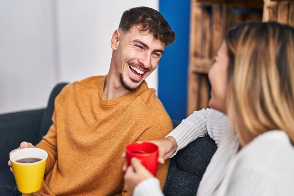 Young Man Woman Couple Drinking Coffee Sitting Sofa Home — Stock Photo, Image