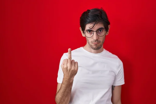 Young Hispanic Man Standing Red Background Showing Middle Finger Impolite — Photo