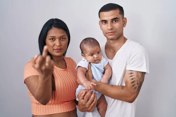 Young Hispanic Couple Baby Standing Together Isolated Background Showing Middle — kuvapankkivalokuva