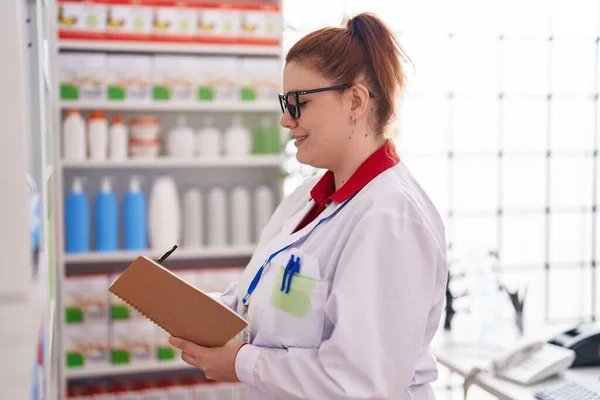 Young Beautiful Size Woman Pharmacist Writing Document Pharmacy — Foto Stock