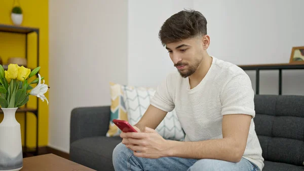 Young Arab Man Using Smartphone Sitting Sofa Home — Foto Stock
