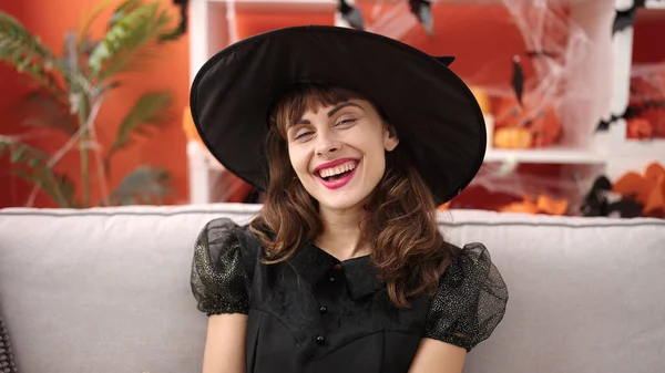 Young Caucasian Woman Smiling Wearing Witch Costume Sitting Sofa Home — ストック写真