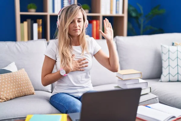 Young Blonde Woman Studying Using Computer Laptop Home Swearing Hand — Stock Photo, Image