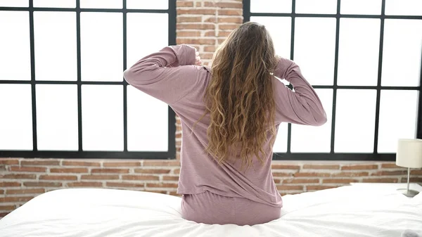 Young Beautiful Hispanic Woman Waking Stretching Arms Back View Bedroom — Fotografia de Stock