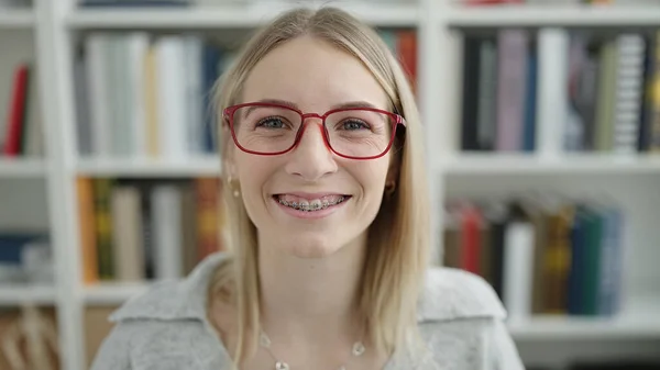 Young Blonde Woman Smiling Confident Showing Braces Library University — 图库照片