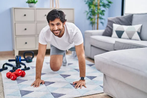 Young Hispanic Man Smiling Confident Training Abs Exercise Home — Foto Stock