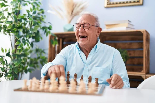 Senior Grey Haired Man Smiling Confident Playing Chess Home — Stockfoto