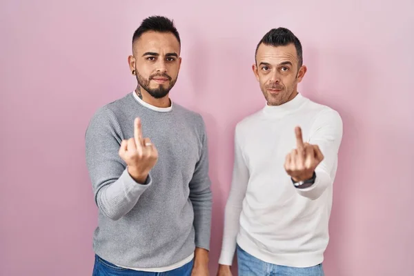 Homosexual Couple Standing Pink Background Showing Middle Finger Impolite Rude — 스톡 사진