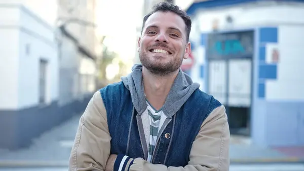 Young Caucasian Man Smiling Crossed Arms Street — Zdjęcie stockowe