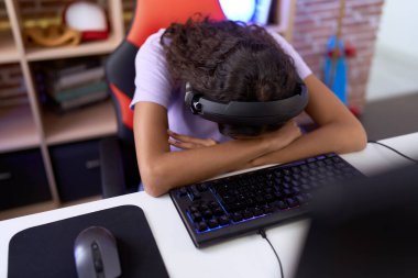 Young african american woman streamer stressed using computer at gaming room