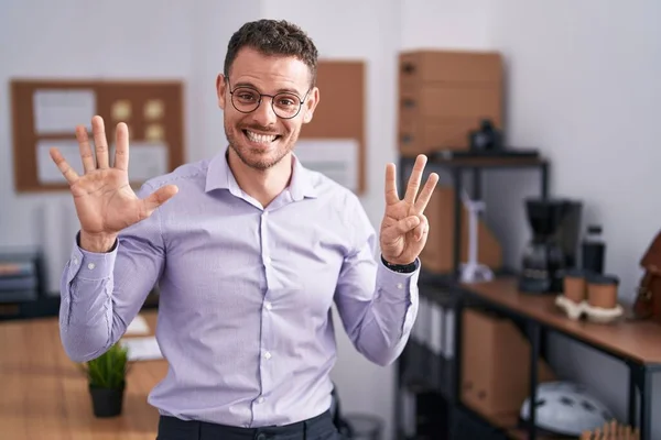 Young Hispanic Man Office Showing Pointing Fingers Number Eight While — Stock Photo, Image