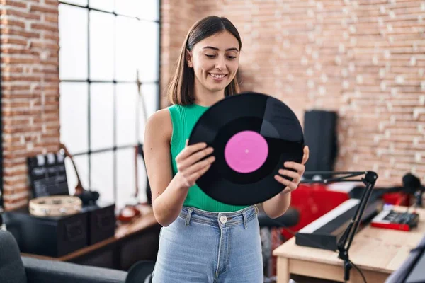 Young Hispanic Woman Musician Holding Vinyl Disc Music Studio — Zdjęcie stockowe