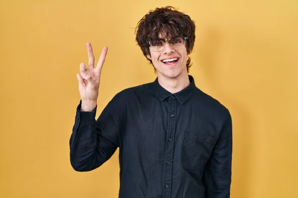 Young Man Wearing Glasses Yellow Background Showing Pointing Fingers Number — Stock Photo, Image