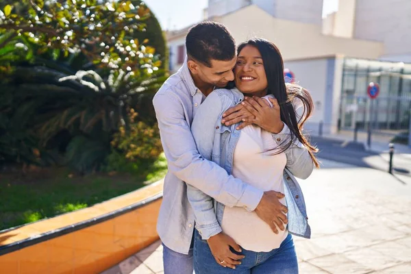 Young Latin Couple Expecting Baby Hugging Each Other Standing Park — Foto Stock