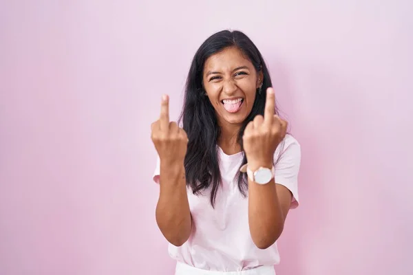 Young Hispanic Woman Standing Pink Background Showing Middle Finger Doing — стоковое фото