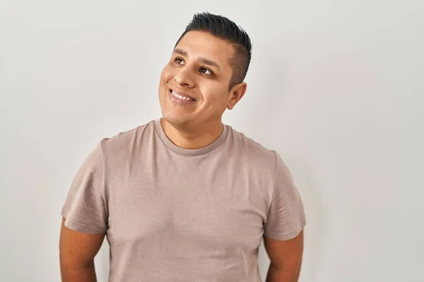 Hispanic Young Man Standing White Background Smiling Looking Side Staring — Stock Photo, Image