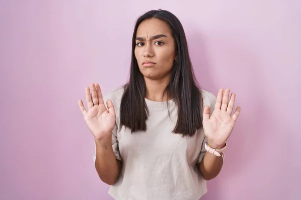 Young Hispanic Woman Standing Pink Background Moving Away Hands Palms — Stockfoto