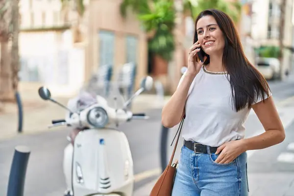 stock image Young beautiful hispanic woman smiling confident talking on the smartphone at street